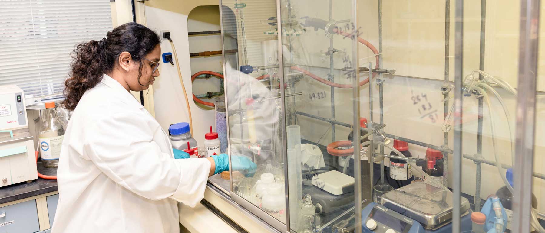 A student works on a medicinal chemistry experiment in a lab